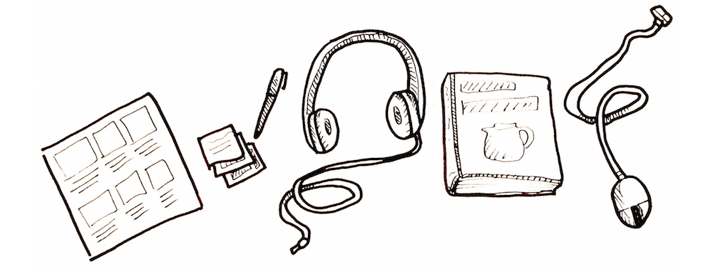 Image of a storyboard, sticky notes, a pen, a pair of headphones, a book, and a computer mouse